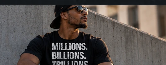 A front-print Millions. Billions. Trillions. black T-shirt in a thoughtful lifestyle setting
